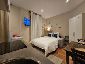 Appartements Aux-Cerfs - Studio coeur de ville : photos des chambres