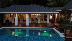 Relax At This Hillside Retreat That Overlooks The Lush Forest And The Caribbean,