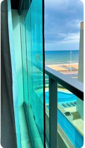 Studio Art - Apartamento climatizado - Prédio a beira-mar, com jacuzzi e piscina - Praia de Armação