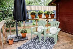 Knus houten huisje met uitzicht Meer Zeeland VP071