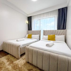 lovely fully furnished three bedroom apartment with swimming pool well equipped gym ample parking space children playing ground and amazing scenic views