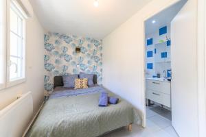 Appartements Le cocon de l-impasse a Tremblay en France : photos des chambres