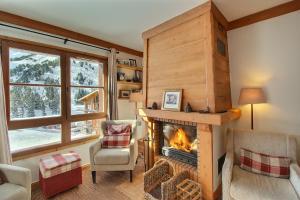 ARC 1950 - Appartement 10 personnes Duplex Cheminée - ski aux pieds - Sauna, Hammam, Jacuzzi, Piscine