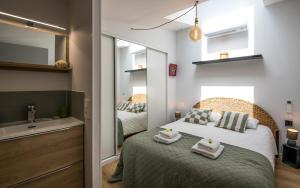 Appartements LA SUITE terrasse, wifi,parking,clim : photos des chambres