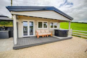 Luxury Log Cabin with Private Hot Tub & Sea Views