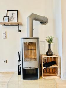 Nordlicht, Olpenitz - moderne Ferienwohnung in direkter Strandnähe mit eigenem Eingang, Sauna, Kaminofen, Terrasse und Parkplatz