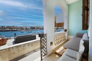 Traditional Maltese Townhouse with Backyard Garden and Seafront Location