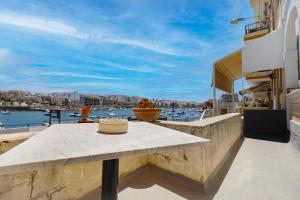 Traditional Maltese Townhouse with Backyard Garden and Seafront Location