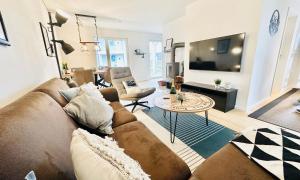 Nordlicht, Olpenitz - moderne Ferienwohnung in direkter Strandnähe mit eigenem Eingang, Sauna, Kaminofen, Terrasse und Parkplatz