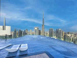 Restay Homes at Paramount Midtown Hotel - Highest infinity pool access with Burj View