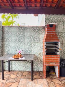 Casa Mongagua Piscina com luz de LED, cascata, churrasqueira jardim vertical