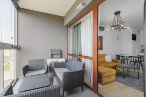 13th Floor Arkadia Apartment by NYX Apart