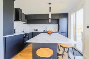 Maisons de vacances L-Orangerie, Maison moderne avec jardin : photos des chambres
