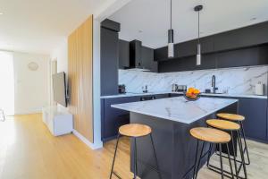 Maisons de vacances L-Orangerie, Maison moderne avec jardin : photos des chambres