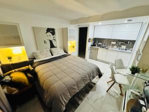 Appartements Studio vue mer dans villa moderne : photos des chambres