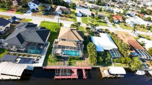 Villa Victoria - Electric-Heated Pool Home on Gulf Access Canal - SWFL Rentals