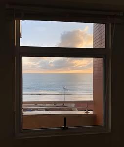 Flat praia a beira-mar