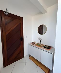 Flat pé na areia à beira-mar