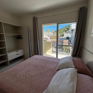 Apartamentos 10m Mar Bombinhas - Morada de Praia Suítes