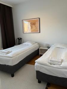 Kotimaailma - A triangle with a sauna in the center