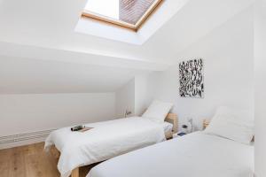 Appartements Beige Hospitalite - Totem Netflix et wifi gratuit : photos des chambres