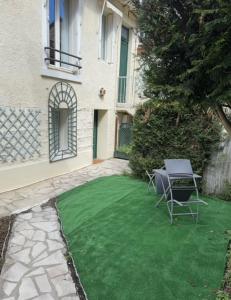 Maisons de vacances Cozy duplex with garden on the outskirts of Paris : photos des chambres