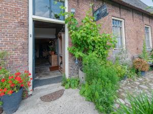 Farmhouse by Lauwers River with Rowing Boat
