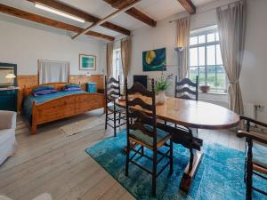 Farmhouse by Lauwers River with Rowing Boat