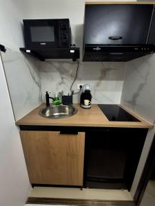 Appartements Blak Miroir Cosy T1 au coeur d-Evry : photos des chambres
