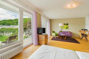 Suite with Balcony and Air Conditioning room in At the Park Hotel