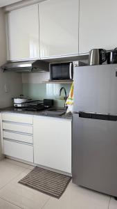 24th Floor City View at Calyx Residences with infinity pool