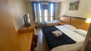 UH 406 - 3 Pessoas e garagem