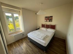 Appartements Le charme de l-ancien au gout du jour avec parking : photos des chambres