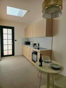 Appartements Studio Le Faubourg - clim : photos des chambres