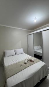 Casa com 2 Quartos Climatizados e Garagem