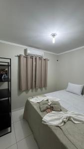 Casa com 2 Quartos Climatizados e Garagem