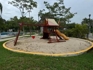 House in front of the Maya Playa del Carmen train