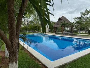 House in front of the Maya Playa del Carmen train