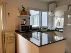 Cerquita del río y con alma de hogar