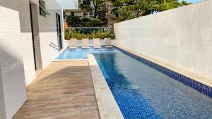 Apto c Varanda, Piscina e Salão de Jogos