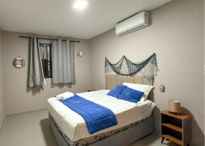 Luxo Frente Mar em 7 Qtos com Ar sendo 4 suites para até 18 pessoas, 2 Jacuzzi Aquecidas, piscina, brinquedoteca, 5min de Castelhanos