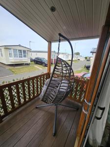 Rhyl Caravan with Veranda Egg Chairs & Garden