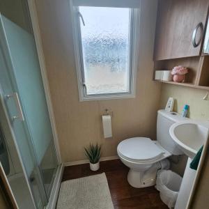 Rhyl Caravan with Veranda Egg Chairs & Garden