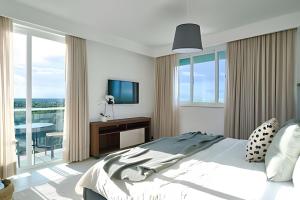 Beachside 1BDR Dreamy Apt.| BBQ + Pool & Sea View