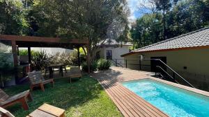 Casa 23 Floresta Boa Vista - 4 Suítes e Piscina Aquecida em Meio à Natureza