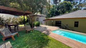 Casa 23 Floresta Boa Vista - 4 Suítes e Piscina Aquecida em Meio à Natureza