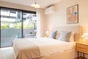 Gaia Elegant Apartment with Patio by LovelyStay