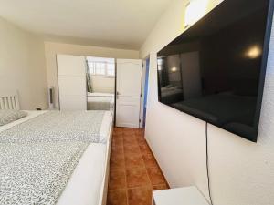 Neptuno Beachfront Retreat with smart TVs and Terrace