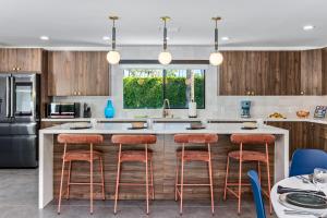 Surrounded by Palms by ACME House Company