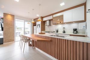 Apto Konzen 2Q perto da praia by Achei Floripa